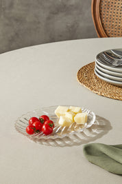 a plate of cheese and tomatoes on a table