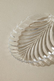 a close up of a glass plate on a table